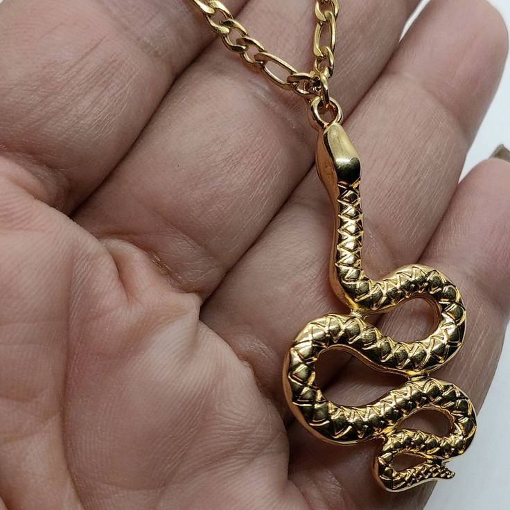 Gold Snake pendant, snake necklace , snake chain necklace, Snake jewelry, Animal necklace, 24k gold filled necklace, bohemian necklace gold Brass 24k plated snake pendant with Figaro stainless steel chain Will ship next working day Silver available here https://www.etsy.com/listing/925133055/snake-ring-silver-ring-statement-ring Necklace Snake Chain, Necklace Snake, Egyptian Necklace, Ankh Necklace, Snake Ring Silver, Animal Necklace, Snake Pendant, Snake Chain Necklace, Gold Filled Necklace