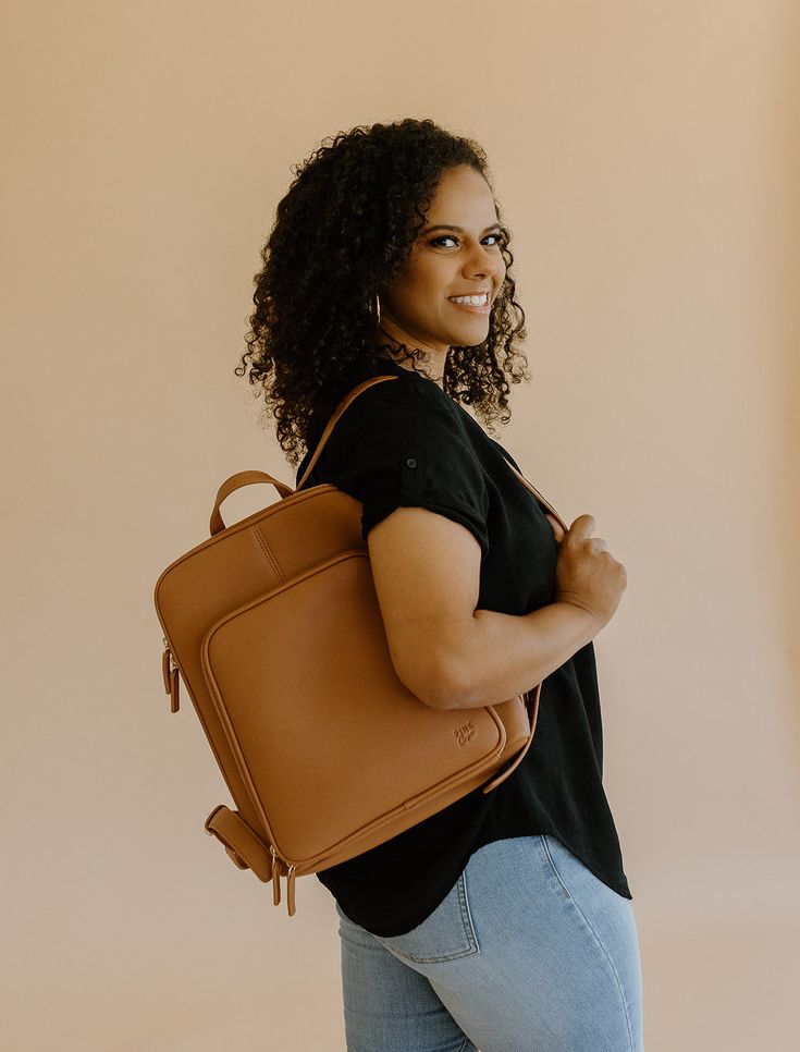 The Olivia Backpack is the most sleek and stylish backpack we've made! Conveniently made to store all the necessary things, including any 13" laptop.  Plenty of pockets to hold and store all the essentials (phone, Chapstick, wallet, hand sanitizer, etc.). Use it for work, school, travel, and everything else in-between. Standard Backpack With Laptop Sleeve For On-the-go, Versatile Rectangular Leather Backpack For On-the-go, Versatile Backpack Laptop Bag For On-the-go, Versatile Laptop Bag With Sleeve For Commuting, Versatile Satchel Backpack For Commuting, Versatile Laptop Backpack For Travel, Daily Use Laptop Backpack With Luggage Sleeve, Versatile Rectangular Backpack For Commuting, Standard Backpack With Luggage Sleeve For Daily Use