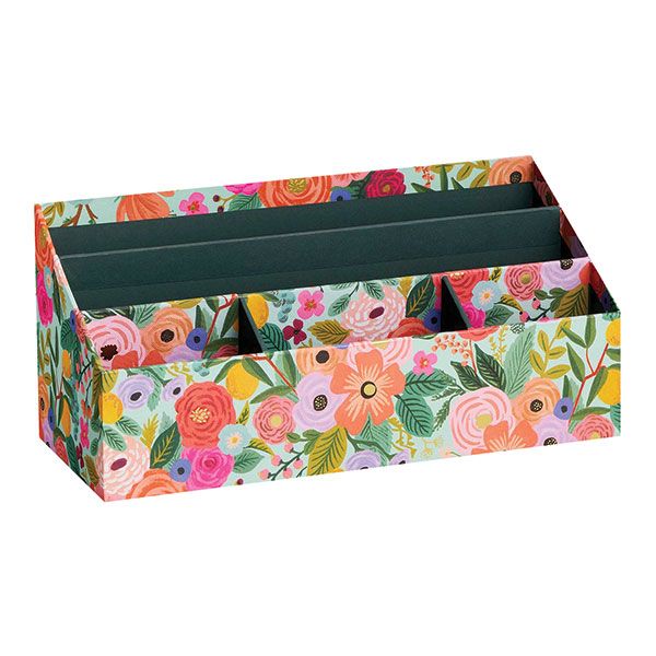 a multicolored floral box with compartments for pens and pencils on a white background