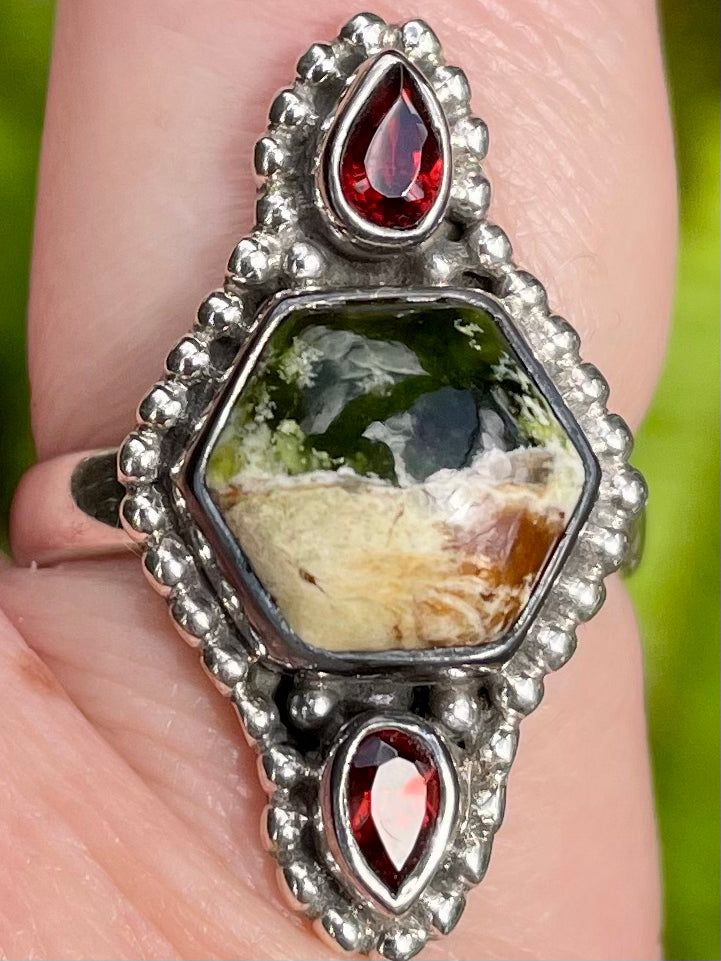 Chrome Chalcedony + Garnet Peace + Joy Chrome Chalcedony is a form of green chalcedony found in Zimbabwe. It gets its green color from the Chromium found in it. Chrome Chalcedony is a stone of balance and harmony. It encourages you to look for the positive in each situation. It is an excellent stone to use to help you with decision making. Chalcedony absorbs negativity and eases self-doubt. It also helps to instill in you a playful, light energy so that you can truly enjoy each day. This stone a Luxury Green Chalcedony Ring, Green Spiritual Healing Gemstones, Green Spiritual Gemstones For Gifts, Spiritual Green Gemstones For Gifts, Spiritual Green Gemstones For Gifting, Green Natural Gemstones As Gift, Green Spiritual Jewelry With Natural Inclusions, Spiritual Green Jewelry With Natural Inclusions, Unique Green Cabochon Ring