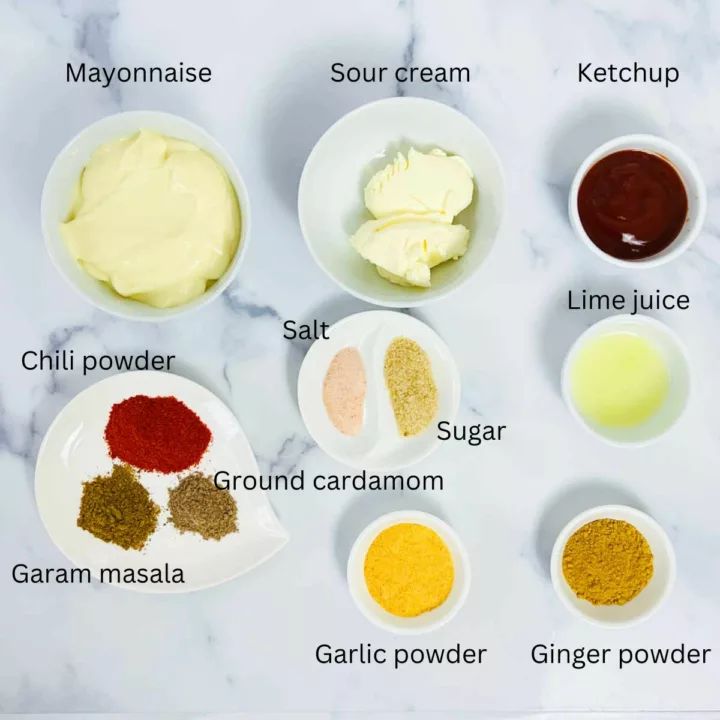 the ingredients to make homemade mayonnaise on a white marble countertop with text overlay