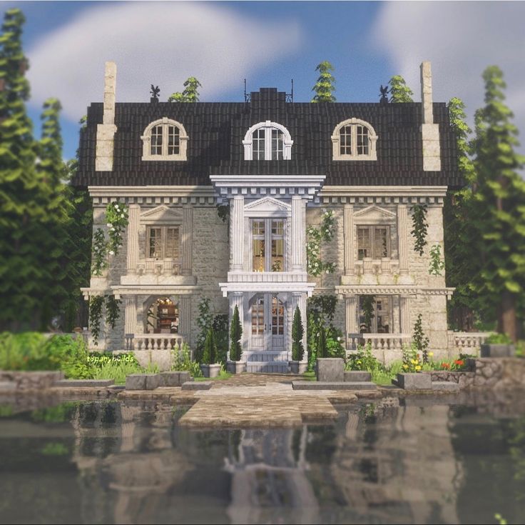 an image of a large house that is in the middle of some trees and water