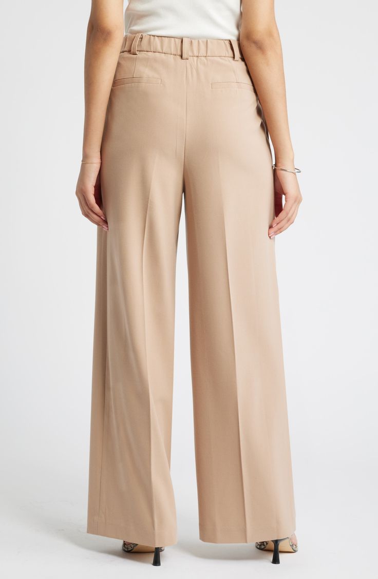 Move from desk days to drinks dates in gracefully draped pants cut from a feel-good fabric. 30" inseam; 24" leg opening; 13" front rise; 16 1/2" back rise (size 8) Zip fly with hook-and-bar closure 62% REPREVE® recycled polyester, 33% rayon, 5% spandex REPREVE recycled polyester is made from 100% post-consumer recycled plastic bottles Machine wash, tumble dry Imported Formal Ankle-length Dress Pants With Elastic Waistband, Spring Business Casual Full-length Dress Pants, Elegant Business Casual Bottoms With Elastic Waistband, Elegant Elastic Waistband Bottoms For Business Casual, Tailored Wide Leg Bottoms For Spring, Beige Wide Leg Bottoms For Business Casual, Spring Office Wide Leg Full Length Pants, Beige Wide Leg Dress Pants For Formal Occasions, Formal Beige Wide Leg Dress Pants