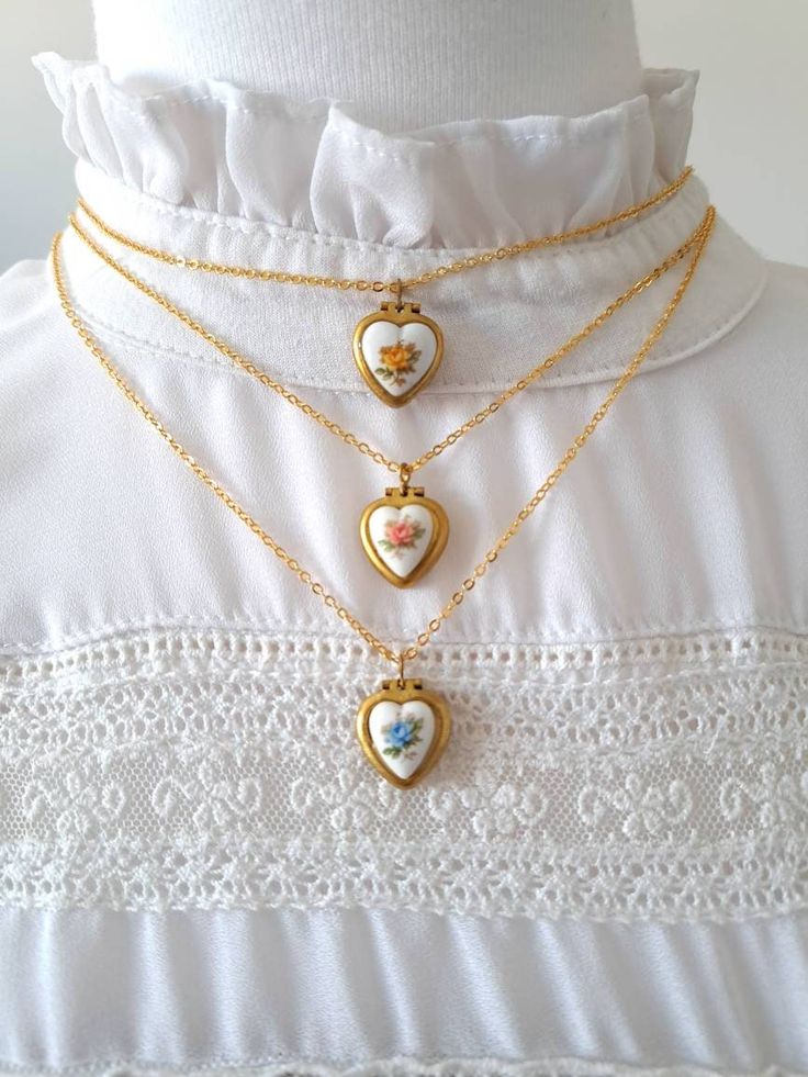 "♥️ Lovely unused 50s vintage tiny heart lockets with Japanese ceramic hearts in a dainty gold plated chain choker measuring 16\" = 40cm or 20\" = 50cm. This small vintage lockets measure 15mm x 14mm and allow adding a picture inside one of the lids. These are very old tiny lockets available in blue, red or yellow flowers. They are made of brass, and most of them have patina or little stains due to the passage of time. This enhances their vintage condition and shows their real age. These are tru