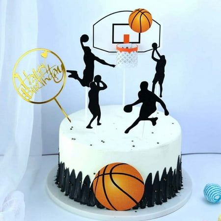 a birthday cake decorated with silhouettes of basketball players