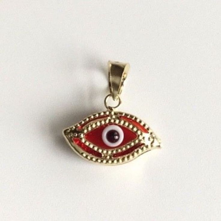 14 K SOLID GOLD RED EVIL EYE PENDANT. REAL 14K GOLD (NOT PLATED OR FILLED).-- 0.6 GR--FOR GOOD LUCK AND PROTECTION PENDANT SIZE : 13 mm X 13 mm ---MADE IN ITALY-BEST QUALITY--- FREE GIFT BOX NOTE:THIS ITEM IS SHIPPED WITH SIGNATURE CONFIRMATION. DIJE DE OJO DE LA BUENA SUERTE EN ORO PURO 14K COLOR ROJO .--0.6 GR-- PARA BUENA SUERTE Y PROTECCIÓN DIJE: 13 mm X 13 mm ---MEJOR CALIDAD-HECHO EN ITALIA--- CAJA DE REGALO GRATIS NOTA:ESTE ARTICULO SERA ENVIADO CON CONFIRMACION DE LA FIRMA. Red Evil Eye, Protection Pendant, Good Luck Bracelet, Protection Bracelet, Eye Pendant, Evil Eye Pendant, Evil Eye Charm, Color Rojo, Fine Jewellery Necklace