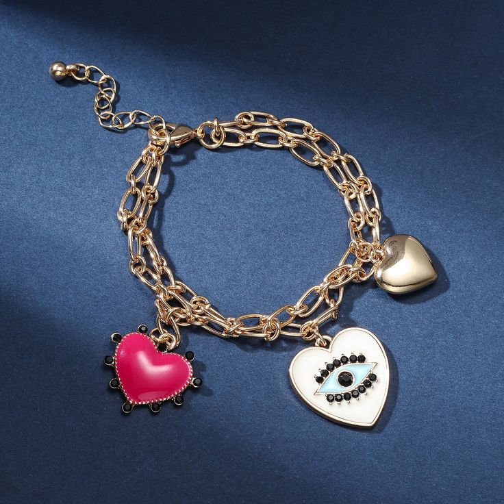 Feel the love with our Evil Eye Heart Bracelet. Crafted with a singular focus, this bracelet offers an exquisitely-crafted representation of protection and love, alluringly adorned with a delightful heart bearing an eye at its center. Ensuring that the wearer is blessed by the all-seeing eye of affection, this luxurious piece is sure to captivate and enchant. Detail Plating: 18K Gold Materials: 18K Gold on Alloy Size:  Length:6.69 "(17cm)+Extender: 2.17"(5.5cm ) Weight: 17.9g Metal Bangle For Promise, Metal Bangle For Promise Occasion, Valentine's Day Gift Heart Bangle Bracelet, Gold Chain Bracelet For Friendship On Valentine's Day, Heart Charm Bangle Jewelry For Gifts, Heart Charm Bangle Jewelry Gift, Gold Double Heart Bracelets With Heart Beads, Gold Bracelet With Double Heart And Heart Beads, Gold Bangle Heart Bracelet For Friendship