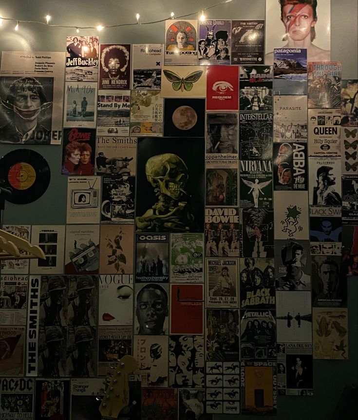 a wall covered with posters and lights