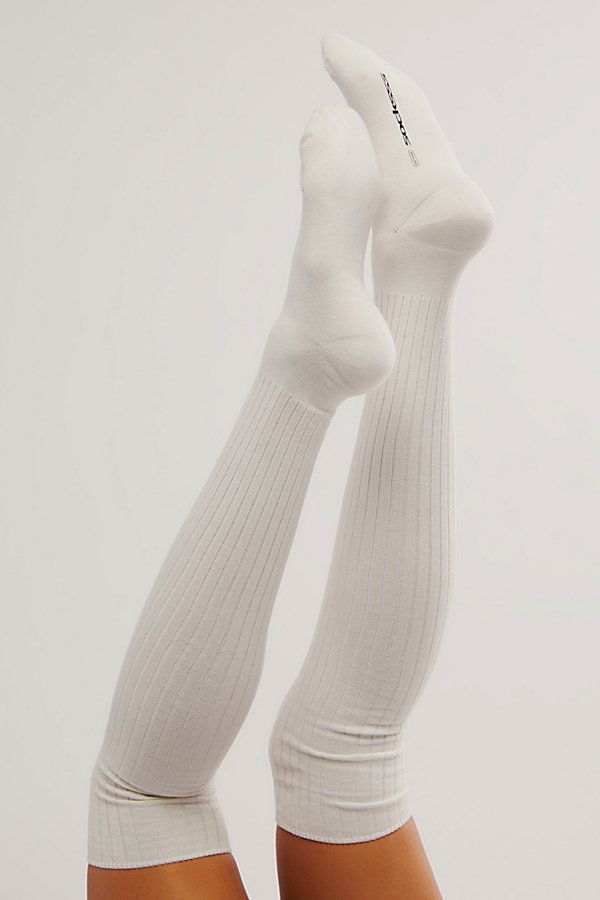 Classic thigh-high socks featured in a soft organic cotton and ribbed knit fabrication with logo-adorned tag detail and seamed toes. **Features:** Thigh-high silhouette, soft organic cotton with a ribbed knit feel, seamed toe, logo detailing **Why We ❤ It:** Perfect paired with mini skirts, dresses, loafers, and flats, these socks can be worn with everything. | Socksss Thigh-High Tube Socks at Free People in White, Size: S-M/P-M Comfortable Soft Ribbed Socks, White Knee-high Comfortable Leg Warmers, Comfortable White Knee-high Leg Warmers, Stretch Cotton Hosiery, Classic White Stretch Socks, Cotton Stretch Solid Color Hosiery, Stretch Cotton Solid Color Hosiery, Fitted Cotton Knee-high Legwear, Soft Fitted Cotton Socks