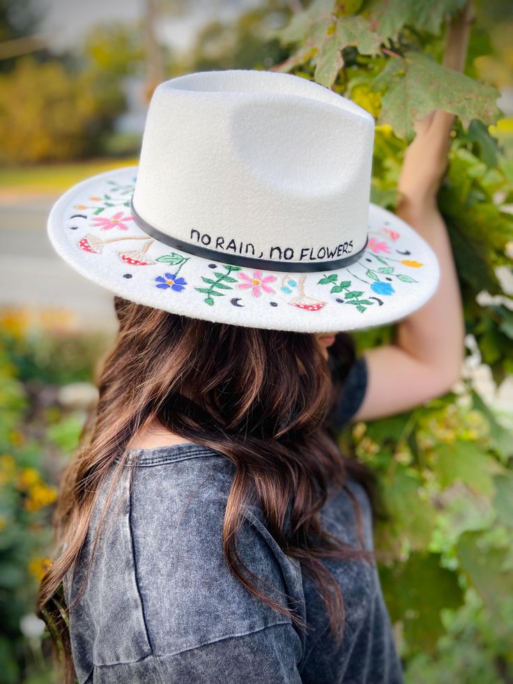 This beautifully detailed floral hat was hand- bunrned for depth in design as well as being hand painted for color and vibrancy on this white hat. It is 57 cm; which would convert to a size medium hat. Artisan Brimmed Panama Hat For Spring, White Panama Hat With Short Brim For Spring, Artisan Flat Brim Sun Hat For Spring, White Felt Hat With Short Brim For Summer, White Curved Brim Panama Hat For Spring, White Flat Brim Felt Hat For Summer, White Wide Brim Felt Hat For Summer, White Flat Brim Panama Hat For Spring, White Wide Brim Fedora For Spring