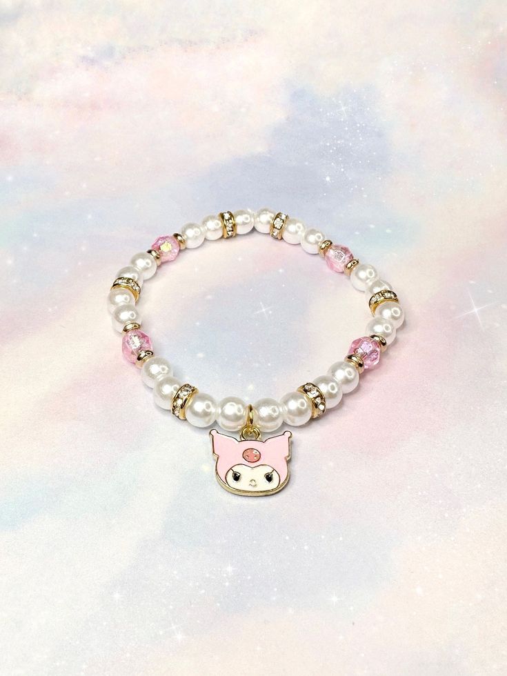 The Pink Kutie Bracelet is an adorable variation of KuromÍ's aesthetic while also being stylish & wearable. Made with accent iridescent pink beads, these beads shimmer and have hints of purple in certain lights.  The gold accents and rhinestones truly highlight the pinks within the bracelet ♡ ☾ ✧.* -6.5 inches (stretchy band) *.✧ ☾  ･ ｡ﾟ☆: *.☽ .* :☆ﾟ.  Handmade with love & moon magic ♡  ･ ｡ﾟ☆: *.☽ .* :☆ﾟ.  - (In CANADA) I ship through lettermail in order to provide free shipping and trying to ke Cute White Hello Kitty Jewelry, Kawaii Jewelry With Cute Adjustable Design, Adjustable Kawaii Jewelry With Cute Design, White Kawaii Jewelry With Cute Design, Adjustable Cute Kawaii Jewelry, Hello Kitty Adjustable Jewelry For Gifts, Adjustable Hello Kitty Jewelry As Gift, Adjustable Hello Kitty Jewelry Gift, Cute Pink Hypoallergenic Charm Bracelet