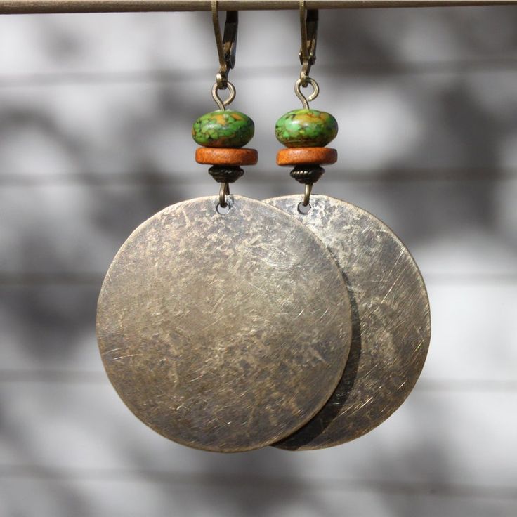 Bohemian Bronze Earrings With Ear Wire, Bronze Bohemian Earrings With Ear Wire, Earthy Metal Dangle Earrings, Bohemian Handmade Round Disc Jewelry, Handmade Bohemian Round Disc Jewelry, Handmade Bohemian Disc Jewelry, Earthy Brass Dangle Earrings, Bohemian Bronze Metal Earrings, Bohemian Brass Earrings With Oxidized Finish