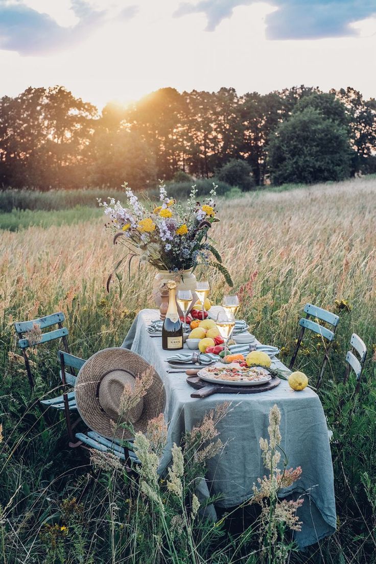 a table set up in the middle of a field