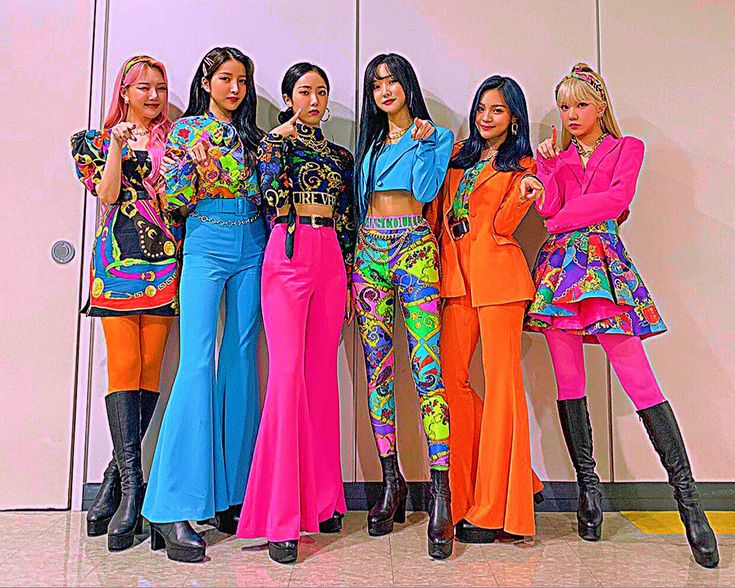 the models are posing together in colorful outfits