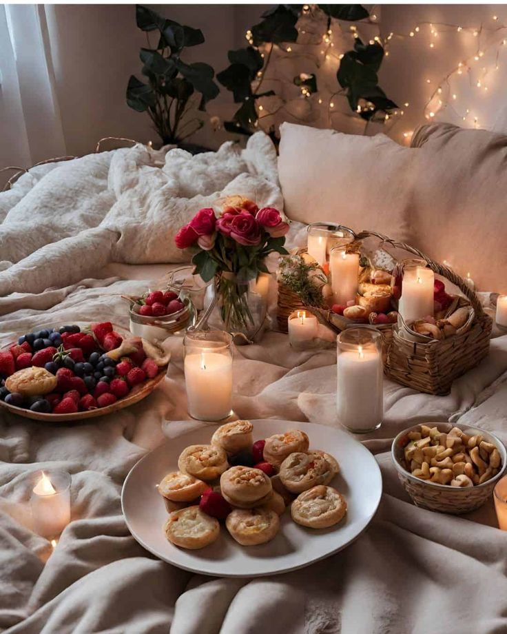 a table topped with lots of food and candles