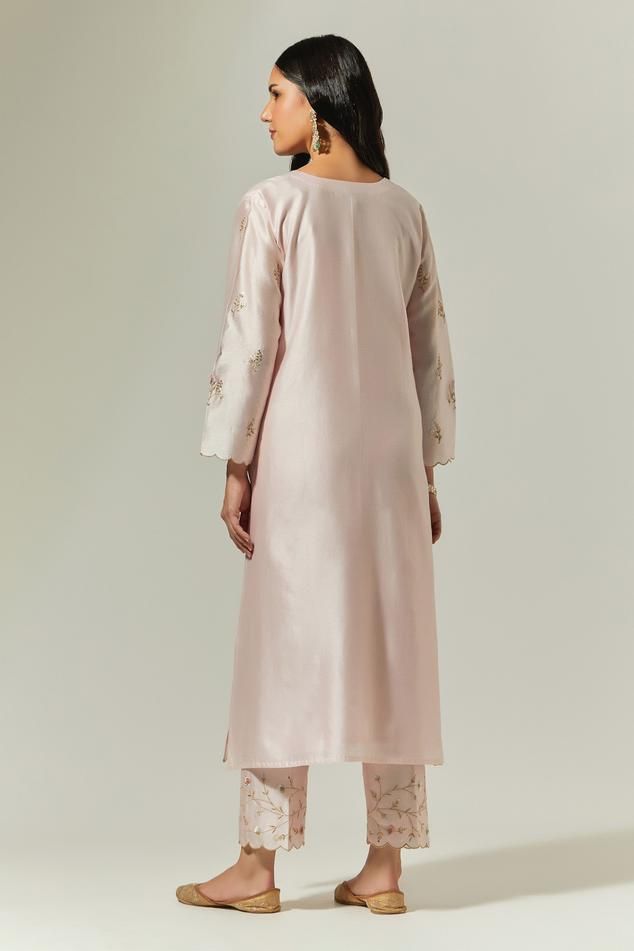 Light pink silk chanderi hand embroidered kurta in floral motifs and scallop borders. Paired with light pink hand embroidered, semi elasticated palazzo and blue hand embroidered dupatta.
Components: 3
Pattern: Embroidered
Type Of Work: Floral
Neckline: Round
Sleeve Type: Scallop
Fabric: Silk Chanderi
Color: Pink
Other Details: 
Embroidered dupatta
Scallop hem palazzo
Palazzo Closure: Semi elasticated
Occasion: Puja - Aza Fashions Kurta Palazzo Set, Kurta For Women, Palazzo Set, Scalloped Hem, Pink Silk, Set For Women, Aza Fashion, Floral Motif, Hand Embroidered