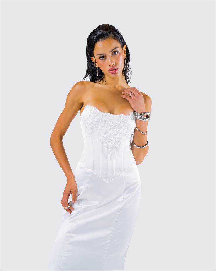 They’ll all be getting down on one knee when they see you in this dress 💍 Made from soft satin fabric, this gorgeous white lace appliqué gown, complete with a fit and flare style and corset boning, will leave a trail of admirers in your wake 🤍 Fitted Lace Back Gown For Debutante Ball, Fitted Ball Gown With Lace Back, White Lace Corset Back Dress, Lace Corset Dress With Fitted Bodice Ball Gown, Lace Ball Gown Corset Dress With Fitted Bodice, White Lace Bodice With Sweetheart Neckline, White Lace Corset Dress With Corset Back, Fitted Lace Corset For Wedding Night, Wedding Corset With Ruched Bodice For Prom Season