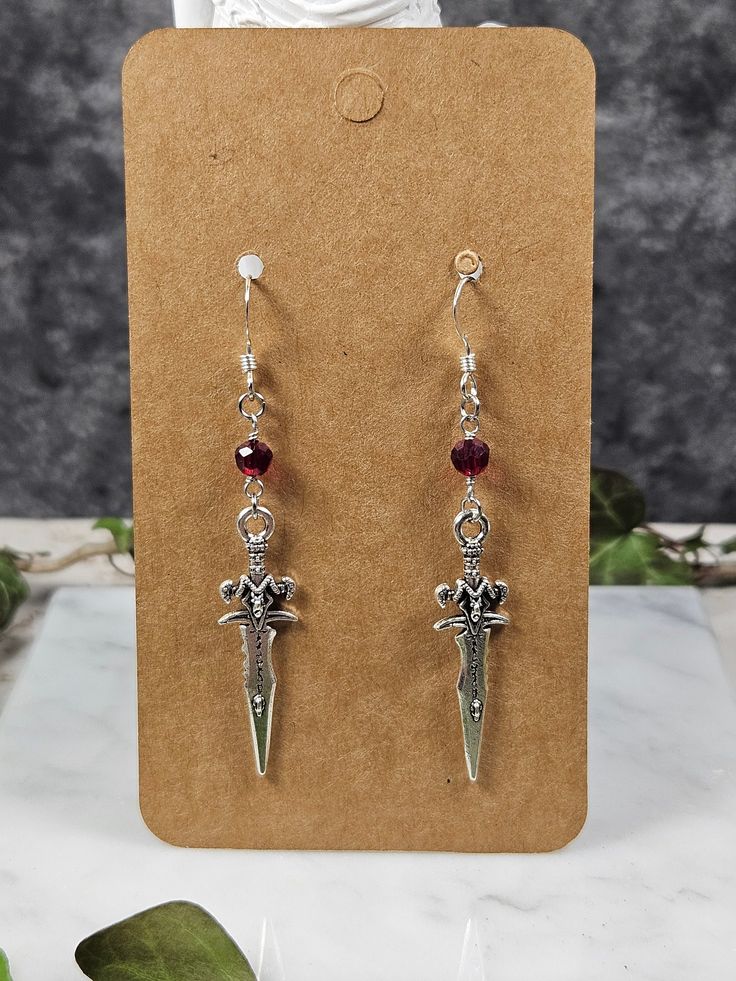 Handmade by Jennifer Nicole. French hooks are .925 sterling silver the rest of the earring is not.  Red beads are made of glass. Red Sterling Silver Dangle Jewelry, Red Sterling Silver Pierced Earrings, Red Sterling Silver Dangle Crystal Earrings, Red Sterling Silver Earrings For Pierced Ears, Handmade Red Sterling Silver Earrings, Red Sterling Silver Drop Crystal Earrings, Red Dangle Jewelry With French Hook, Red Sterling Silver Crystal Drop Earrings, Silver French Hook Earrings As Gift