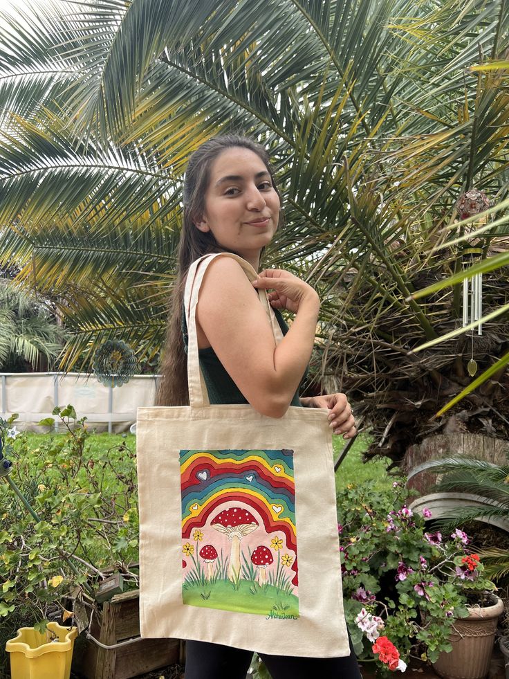 *please message me before placing order  *pictured bag is just an example but I can make a bag like it if you choose :-) * TOTE BAG IS: -- 15 x 16" in size -- Made of 100% 5 oz natural cotton -- Eco-friendly reusable bag, perfect for any occasion, good for carrying books, going to the beach, etc HOW IT WORKS: -- wait time is 1-2 weeks unless I say otherwise. -- designs painted with a mixture of acrylic and fabric medium. -- Upon purchase I will draw out a design (by pencil) and send you a pictur Square Canvas Shoulder Bag Gift, Square Canvas Shoulder Bag For Gift, Handmade Canvas Satchel Bag, Eco-friendly Tote Shoulder Gift Bag, Square Canvas Shoulder Bag Perfect For Gifts, Eco-friendly Tote Shoulder Bag For Gifts, Natural Canvas Tote Bag For Gift, Natural Color Canvas Tote Bag For Gifts, Large Canvas Shoulder Bag Gift