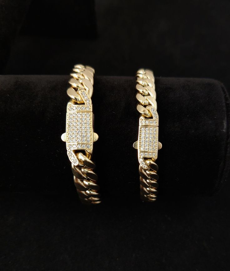 "14k Yellow Gold Miami Cuban Chain Bracelet Zirconia Box Lock, 7.4mm and 9.4mm Real 14K Yellow Gold,,14k Gold Bracelet, 14k gold Miami cuban * Metal : Real 14K Yellow Gold, (Properly Stamped, 14K) * Condition : Brand New * Finish : Polished * Weight : 8.5 grams 8 inches 7.4mm 14.5 grams 8.5 inches 9.4mm * Length : 7, 7.5, 8, 8.5 inches * Width :7.4mm and 9.4mm * Clasp/Bail : Box Clasp Lock with cubic zirconia (cz) These Chains made with solid 100% Authentic 14K Gold \"Not Plated or Filled\" This Gold Iced Out Bracelets For Formal Occasions, Iced Out Gold Bracelet For Formal Occasions, Gift Cuban Link Diamond Bracelet With 17 Jewels, Gold Tennis Bracelet With Diamond Accents And Cuban Link, Gold Cuban Link Bracelet With Cubic Zirconia, Formal Cuban Link Bracelet With Diamond Accents In Gold, Formal Gold Iced Out Bracelets, Gold Cuban Link Tennis Bracelet With Diamond Accents, Gold Cuban Link Diamond Bracelet As Gift