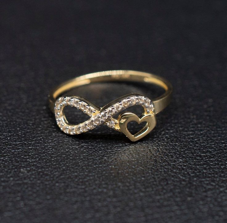 "14k Real Solid Yellow Gold Infinity Heart Ring, 14k Solid Gold Women Heart Ring, Infinity Symbol Gemstone Gold Ring for Women, Gift,  Gold Ring, Minimalist Ring * Metal : Real 14K Yellow Gold, (Properly Stamped, 14K)  * Condition : Brand New * Finish : Polished * Band thickness: 1.5 mm  * infinity Size: 17 mm length, 7mm width * Scale: : 6,5US, 7US, 7.5US,8US, 8.5US * Stone: Cubic Zirconia These Rings are 100% Authentic 14K Solid Real Gold .  \"Not Plated or Filled\" This is a Beautiful Genuine Real 14K Solid Gold  Infinity Ring BOSPHORUSGOLD" Infinity Heart Ring, Infinity Rings Gold, Infinity Gold Rings For Women, Infinity Promise Jewelry With Diamond Accents, Infinity Shaped Promise Jewelry With Diamond Accents, Infinity Jewelry With Diamond Accents For Promise, Infinity Heart Ring For Valentine's Day Anniversary, Valentine's Day Infinity Heart Ring For Anniversary, 14k Gold Infinity Jewelry For Anniversary