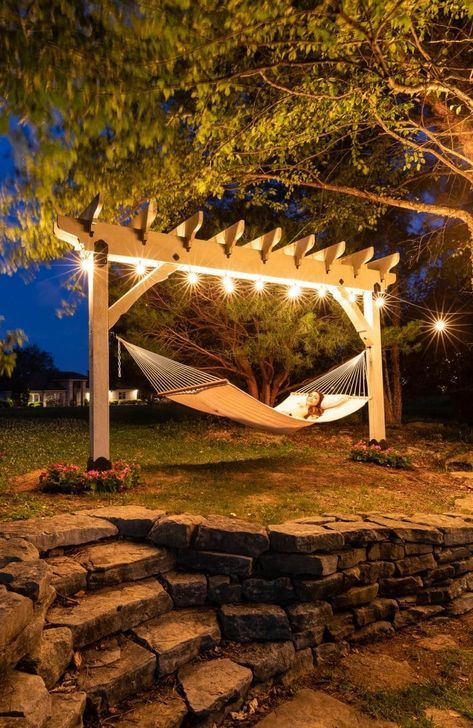 a hammock is lit up in the evening