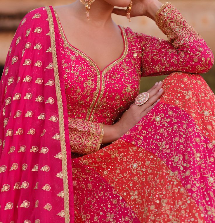 COLOR : Orange & Pink FABRIC : Gown & Dupatta - Premium Georgette WORK : Heavy Zari Work, Hand Work, Motifs, Stones, Pearls, Swarvoski, Sequins, Embellished Lace Border OCCASION : Wedding, Reception, Engagement, Bridal Wear READY-TO-WEAR : NoSTITCHING : Available as semi-stitched fabric, can be stitched using standard size option (+$30). Note: There might be a slight color variation due to lighting and flash used during photoshoot. The bright shade seen is the best closer view of fabric's color. Bridal Anarkali, Anarkali Gown, Pink Bridal, Zari Work, Georgette Fabric, Lace Border, Hand Work, Pink Fabric, Indian Bridal