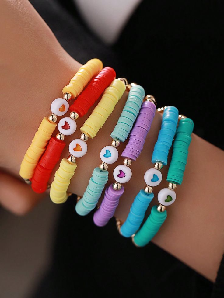 four different colored bracelets with evil eyes on them