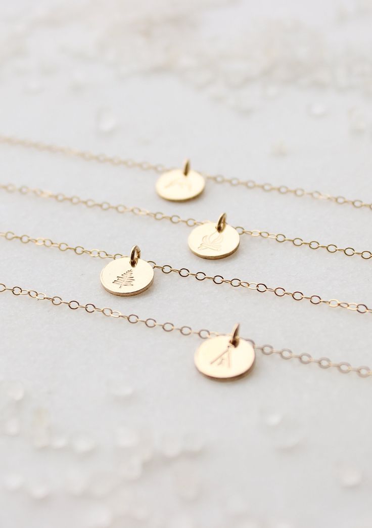 Our sweet, tiny dot stamped with one of our little symbol stamps. A solid 9mm disc is hand-stamped and attached to a delicate 18” chain. Different chain length can be requested using 'Notes' at checkout. Available in Sterling Silver and 14kt Gold Fill. Handmade in Eau Claire, WI. All of our jewelry is handmade to order just for you so each piece will be unique and may vary slightly from what is pictured. Due to its handmade nature, please allow 3-5 business days for orders to ship. Layered Chains, 14kt Gold, Cable Chain, Chain Lengths, Chain Length, Hand Stamped, Handmade Natural, Gold Filled, Pearl Necklace