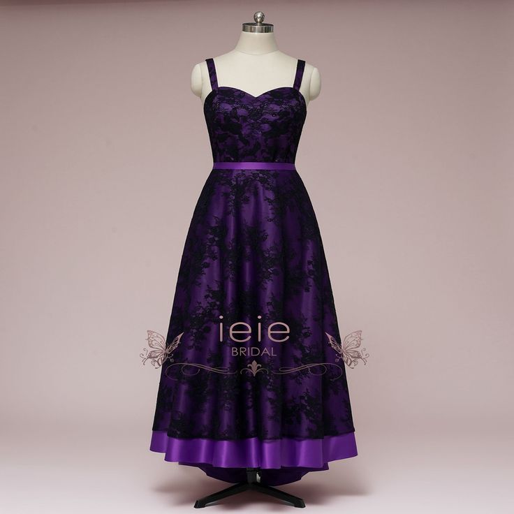 a purple dress on a mannequin with the word ieie written across it