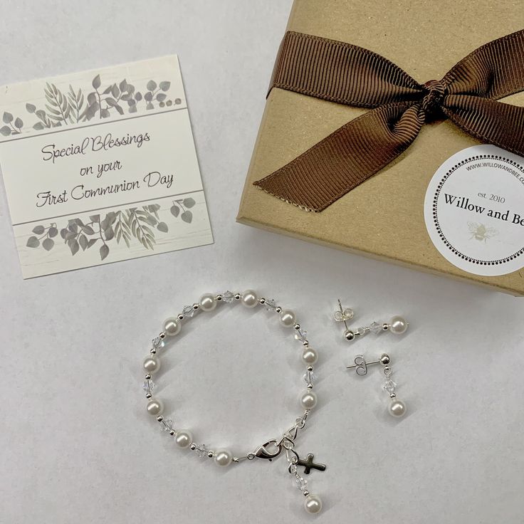 Enjoy 10% off as I celebrate 10 years on Etsy! This lovely First Communion bracelet and earrings set is sure to be the perfect gift! The beautiful bracelet also doubles as a single decade rosary. This classic bracelet has been a big seller as First Communion jewelry, Confirmation jewelry, Easter bracelet, Flower Girl gift, Maid-of-Honor jewelry, Bridesmaids matching bracelets, Mother-of-the-Bride jewelry, Godmother gift, and as Bridal jewelry. Description: -Bracelet measures 5 ½ inches plus a 1- Confirmation Jewelry, Communion Gifts Girl, Bracelet And Earring Set, Decade Rosary, Bracelet Flower, First Communion Gifts, Godmother Gifts, Bride Jewelry, Communion Gifts