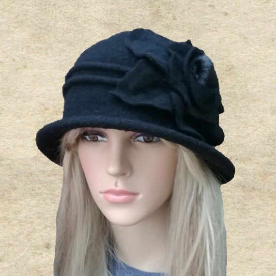 This felted wool cloche hat is very warm. It's perfect to wear in fall/winter seasons. The hat is lightweight and easy to wear. It's well match with any outfits.One size fits most an average women's head (21.5" - 22.5")Composition: 100% WoolHand wash in cold water and lay flat to dry. Do not use a dryer!NOTEActual color may slightly different depending on your monitor.Please contact us if you have any questions for the color. Fur Felt Cloche Hat With Short Brim For Fall, Fall Cloche Hat With Short Brim In Fur Felt, Fall Wide Brim Fur Felt Cloche Hat, Classic Winter Cloche Felt Hat, Classic Cloche Felt Hat For Winter, Fitted Wool Cloche Hat With Short Brim, Fitted Wool Cloche Hat, Adjustable Wool Brimmed Cloche Hat, Adjustable Brimmed Wool Cloche Hat