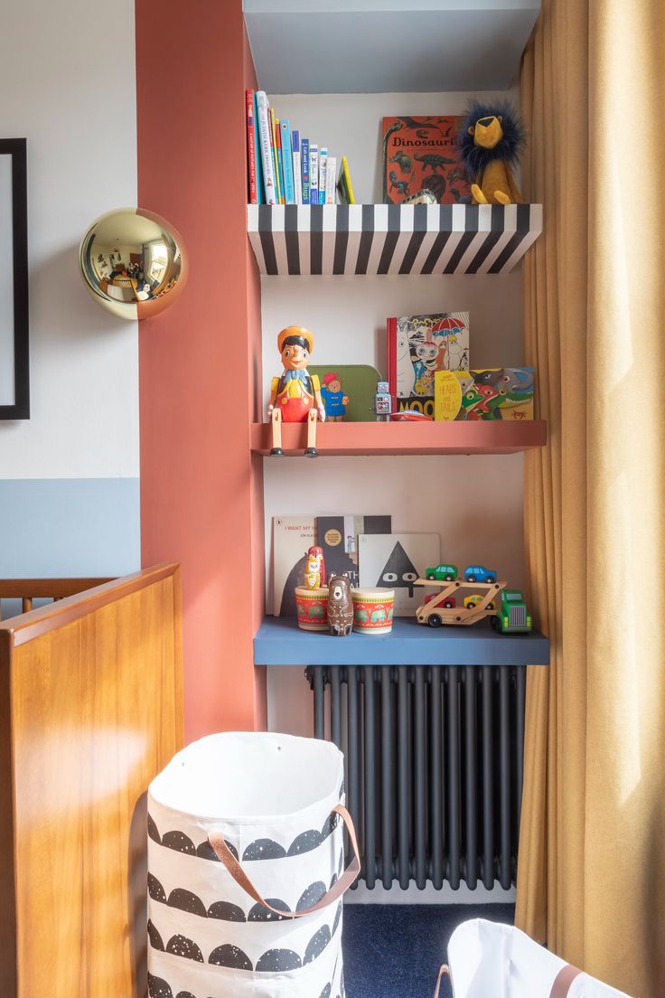 a child's room with bookshelves, toys and other items on the shelves