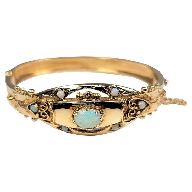 14 Karat yellow gold bangle with opal center stone and opal accents. This charming bracelet is from the 1950's. Opal Bangle, Yellow Gold Bangle, Opal Bracelet, Gold Bangle, Gold Bangles, Sapphire Ring, Diy Jewelry, Jewelry Bracelets, Opal