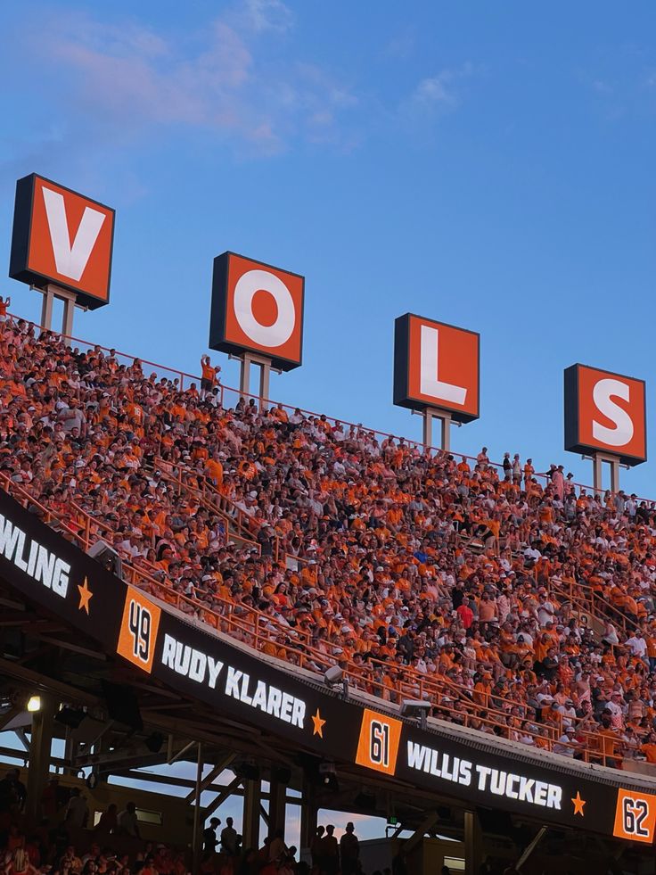 an orange and black stadium sign with the word volls on it's side