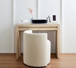 a white stool sitting next to a wooden table