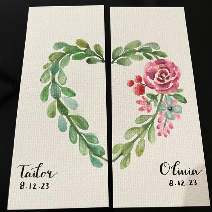 two cards with watercolor flowers and leaves in the shape of a heart on them