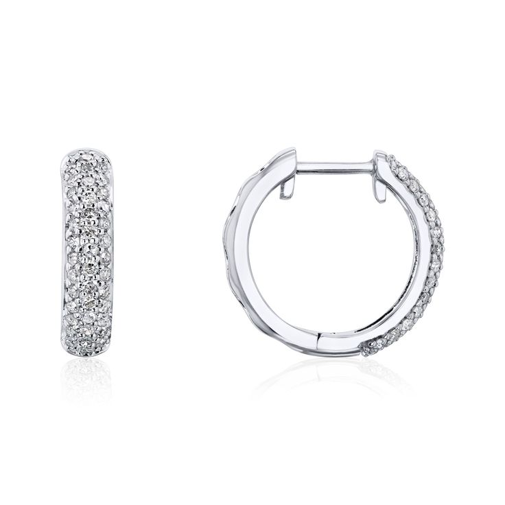 Mini Hoop Pave Earrings Not your ordinary hoops. A pair of hoop earrings is adorned with a pave of round natural diamonds halfway through the body. Each hoop's back design features a filigree for a unique look, almost like a sweet surprise only known to the wearer. 80 Round Natural Diamonds (1/2 Carat TDW) 10k White Gold Genuine Photos All photos on this product are taken in-house with real stock set with the described carat weight. White Hoop Diamond Earrings With Single Cut, Hoop Diamond Earrings With Halo Design, Round Hoop Earrings With Pave Setting For Wedding, Fine Jewelry Hoop Earrings With Pave Setting, Diamond Huggie Earrings With Pave Setting, Wedding Hoop Earrings With Pave Setting Round Cut, Small Hoop Diamond Earrings In White Gold, Hoop Diamond Earrings With Pave Setting, Sterling Silver Small Hoop Diamond Earrings With Halo Design