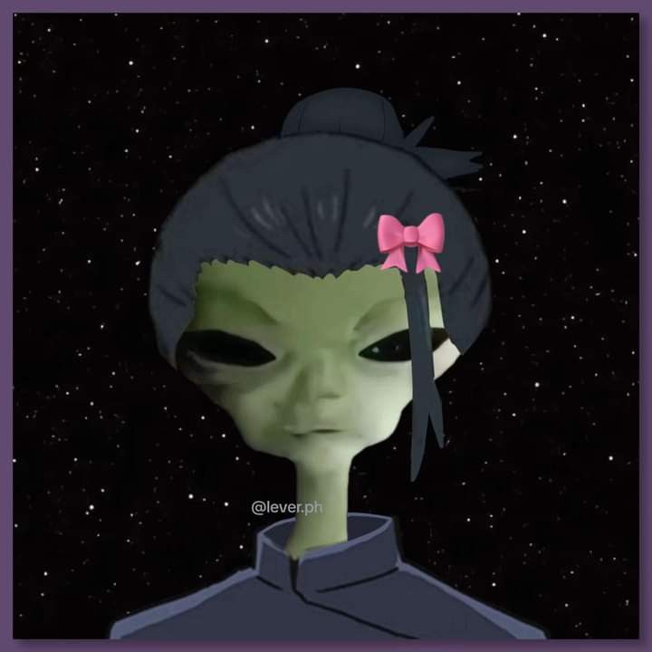 an alien with a pink bow in her hair