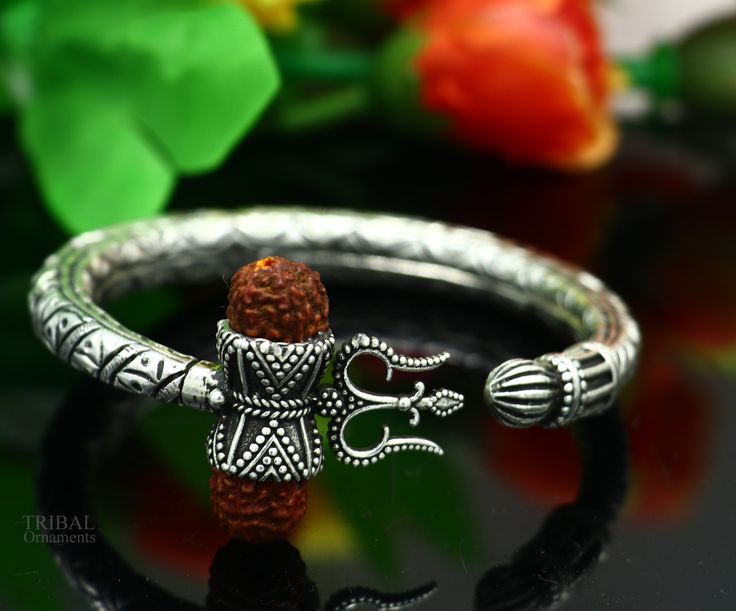 Amazing handcrafted chitai or kandrai work 925 sterling silver vintage design custom made oxidized silver personalized unisex gifting jewelry from india. Metal-925 sterling silver. Item type-Bangle /bracelet/ Kada. Weight-44.500 grams. Size-2-6 (2.375 inches inner diameter)We can easily adjust by twisting it for bigger size. Width-0.9 centimeters trident shape size-3.1cm approx. stamped- 925. Finish-Oxidized. Makes excellent gifting for birthday, mother's day, father's day, Christmas day,valenti Silver Bracelets For Navratri, Sterling Silver Bangle For Ceremonial Festivals, Sterling Silver Bangle For Rituals And Festivals, Silver Bracelet For Navratri Rituals, Silver Bracelet For Navratri Festival, Silver Bracelet For Navratri Festive Occasion, Handmade Silver Bangle For Diwali, Silver Bracelets For Navratri Rituals, Festive Silver Bracelets For Navratri