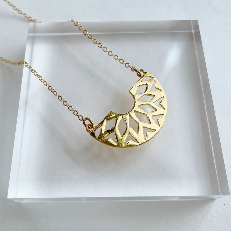 "Powell Gold Plated Pendant on gold Plated Chain. Approx. pendant measurements: 3/4\"L x 1.5\"W. Necklace length: 17.5\"L plus 2\" extender ." Gold Flower Pendant Chain Necklace As Gift, Minimalist Gold Necklace With Large Pendant, Gold-plated Crescent Charm Necklaces, Gold-plated Crescent Charm Necklace, Gold Metal Moon Charm Necklace, Gold Brass Charm Necklace With Large Pendant, Gold Plated Crescent Charm Necklaces, Gold-plated Crescent Necklace, Gold Plated Crescent Charm Necklace