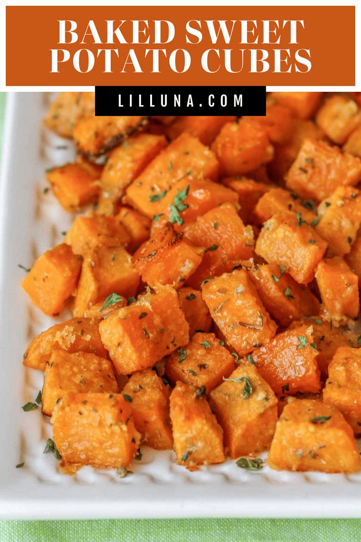 baked sweet potato cubes on a white plate with the title text overlay reads baked sweet potato cubes