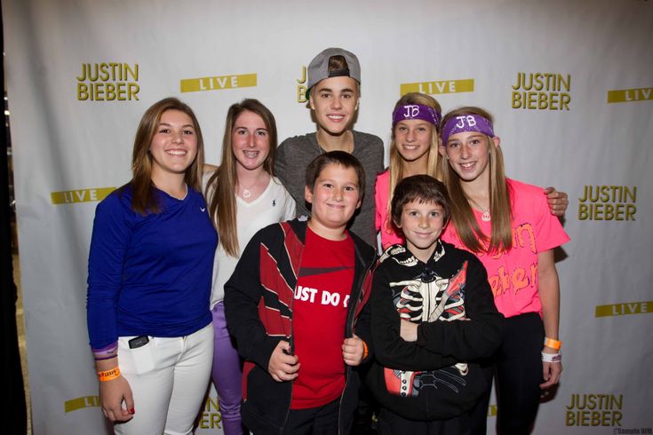 a group of young people standing next to each other