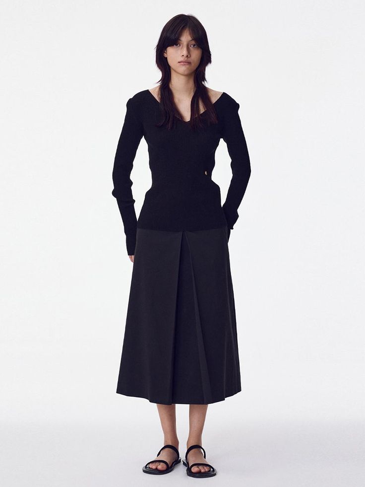 The Inverted Pleat Skirt is a beautifully tailored piece that showcases classic design with a modern twist. It features a high-waisted fit that accentuates the waistline, while the inverted pleats create a graceful, flowing movement. - This skirt is designed with a structured waistband to provide support and a seamless silhouette.- The inverted pleat detail not only adds an element of sophistication but also allows for a greater range of motion.- It's a versatile item that can be dressed up for formal occasions or paired down for a day at the office.- Meticulously stitched, the skirt holds its shape throughout the day, making it both stylish and practical for continuous wear. Chic Fitted Pleated Skirt For Evening, Chic Evening Pleated Skirt With Accordion Pleats, Elegant Asymmetrical Skirt With Folds, Chic Formal Skirt With Folds, Elegant Pleated Skirt For Evening, Elegant Evening Skirt With Pleated Hem, Chic Evening Bottoms With Folds, Fitted Flared Pleated Skirt For Formal Occasions, Fitted Pleated Skirt For Formal Fall Events