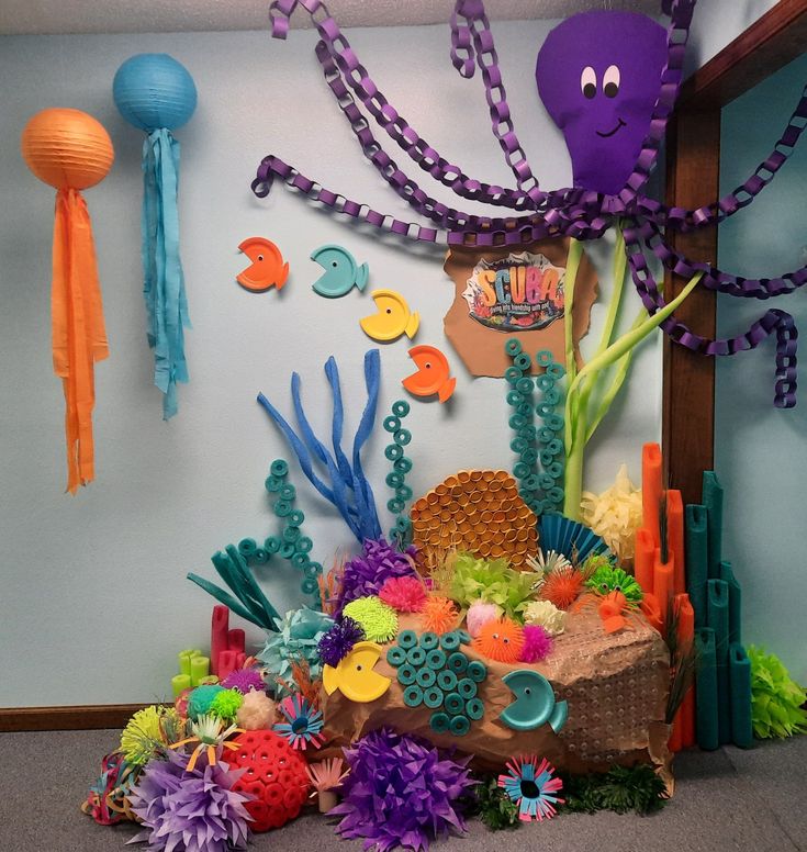 an under the sea themed room with paper decorations