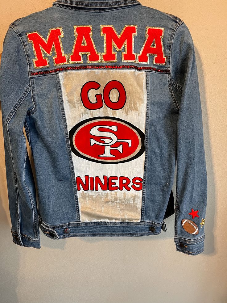 Custom painted and Glammed football jean jackets Football Jean Jacket Girlfriend, Diy Jersey Shirt, Football Mom Outfit, Painted Football, Jean Art, Custom Jean Jacket, Diy Denim Jacket, Party 2023, Diy Denim