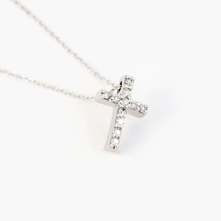 Our Diamond Cross Christian Necklace in 14K Solid Gold is a stunning representation of faith and fashion combined. This radiant diamond Christian pendant necklace, made from 14K real gold, is an ideal gift for her, offering an elegant symbol of spirituality. Designed for women, this religious jewelry piece is a charming statement of devotion, making it a perfect gift for any occasion. 14k solid gold handcrafted pieces 100% ethical sourced jewelry Material: 14k Solid Gold Diamond Type: Diamond Di Diamond White Sterling Silver Crucifix Jewelry, Sterling Silver Crucifix Jewelry In Diamond White, Brilliant Cut Cross Pendant Necklaces, White Gold Crucifix Jewelry With Cubic Zirconia, White Gold Cubic Zirconia Crucifix Jewelry, Diamond White Sterling Silver Crucifix Necklace, Sterling Silver Cross Pendant Diamond Necklace For Anniversary, Diamond Cut Diamond Cross Necklace As Gift, Diamond Cross Necklace As A Gift