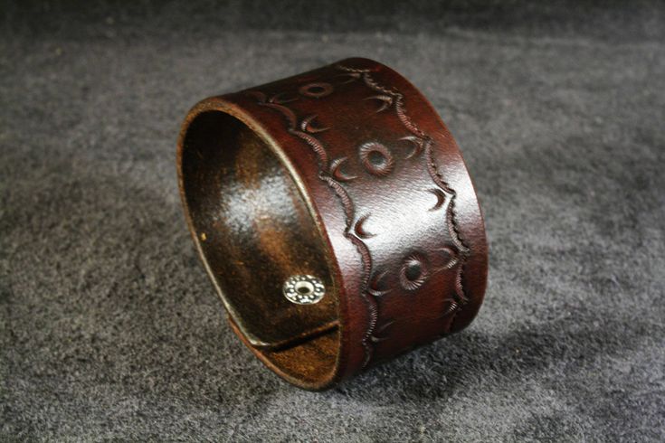 "This leather bracelet is made from vegetable tanned leather and colored with special coloring in brown color. On the bracelet is tooled an original ornament. It will be great gift. 100% handmade item. Width 1,6 inches (4cm) Leave your desired size of your wrist in the \"notes to seller\" section. If you have any questions about the product or about the size, please contact with me, I'll be glad to answer them. Maybe you have any special wishes or suggestions, let me know and together we will cr Distressed Brown Leather Bracelets As Gift, Vintage Brown Leather Bracelet As A Gift, Vintage Brown Leather Bracelet As Gift, Vintage Brown Leather Strap Bracelet As Gift, Brown Leather Strap Wristband, Brown Leather Stamped Jewelry, Handmade Vintage Brown Leather Bracelet Gift, Traditional Brown Leather Bracelet As Gift, Traditional Handmade Brown Cuff Bracelet