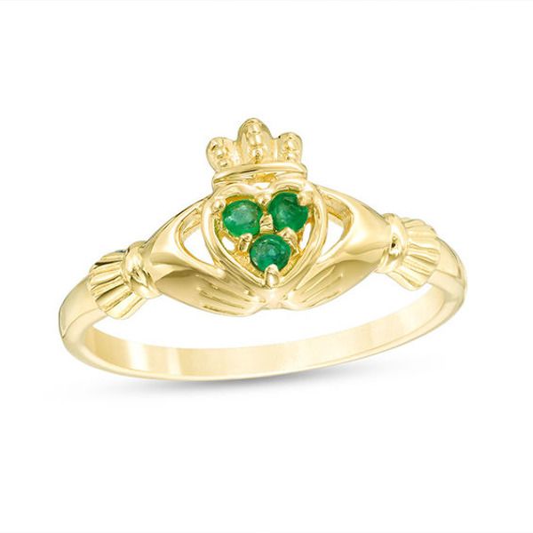 Unite two people in faith, friendship and love with this charming gemstone Claddagh ring. Created in warm 10K gold, this traditional-with-a-twist design features a tiny trio of round verdant-green emeralds at the center. Certain to delight, this iconic ring is polished to a bright shine. 14k Gold Emerald Promise Ring, May Birthstone, 14k Gold Emerald Ring For Promise, May Birthstone, Green 14k Gold Promise Birthstone Ring, Promise Emerald Birthstone Ring In Yellow Gold, Yellow Gold Emerald Birthstone Ring For Promise, Green Three-stone Birthstone Ring In 14k Gold, Green Three Stone Birthstone Ring In 14k Gold, Yellow Gold May Birthstone Promise Ring, Gold Three Stone Ring For May Birthstone