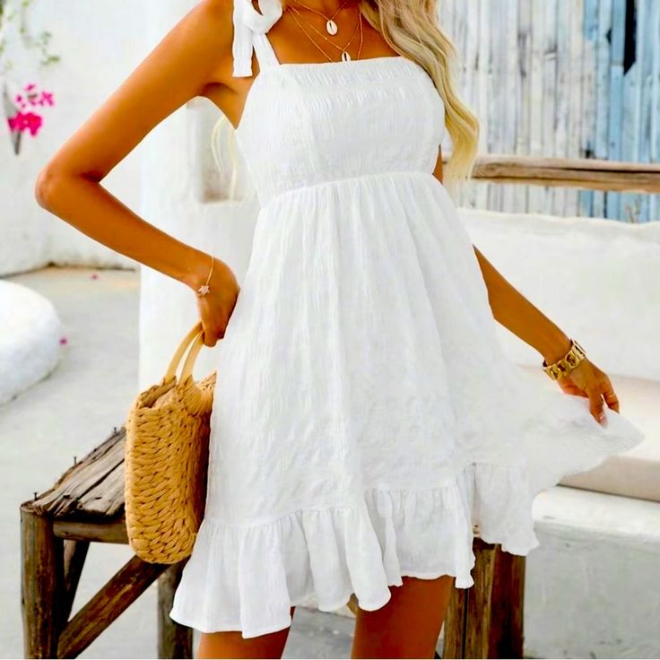 Textured Ruffled Hem Knotted Shoulder Summer Dress. Flowy And. A Line Beach Dress. Large And Never Worn. Chic Mini Dress With Ruffled Straps For Vacation, Chic Summer Mini Dress With Ruffled Straps, Summer Mini Dress With Spaghetti Straps And Ruffles, Chic Sundress With Ruffled Straps For Vacation, Vacation Mini Dress With Ruffled Straps, Summer Sundress With Ruffled Straps For Brunch, Chic Beach Sundress With Ruffled Straps, Summer Mini Dress With Ruffled Straps For Day Out, Beach Chic Sundress With Ruffled Straps